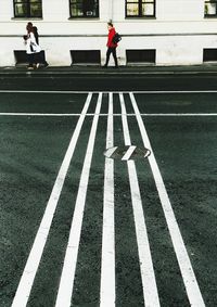 Woman walking on road