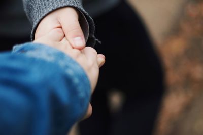 Close-up of man holding hands
