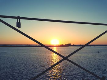 Scenic view of sea against orange sky