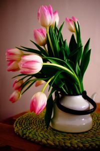 Close-up of pink flower vase on table