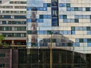 Full frame shot of modern glass building in city