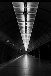 Central perspective of munich subway station marienplatz in black and white