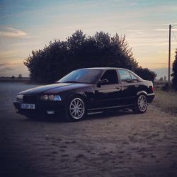 Vintage car against sky during sunset