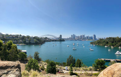 View of city buildings against clear sky