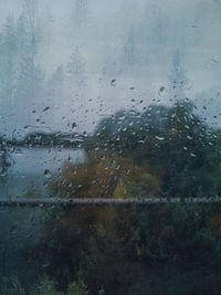 Full frame shot of wet glass window in rainy season