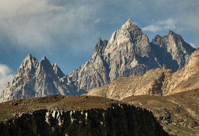 Panoramic view of snowcapped mountains against sky