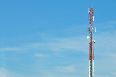 Low angle view of communications tower against sky