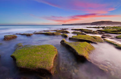 Scenic view of sea against sky during sunset