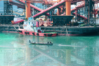 Boats in swimming pool at harbor