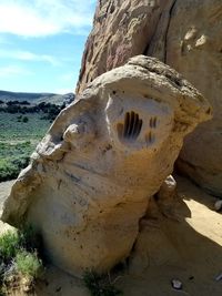 Rock formation on land against sky