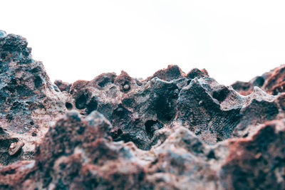 Close-up of rocks against clear sky