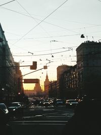 Traffic on city street during sunset
