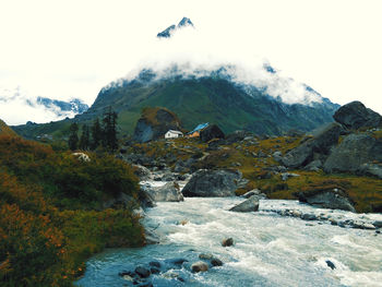 Scenic view of snowcapped mountains against sky
