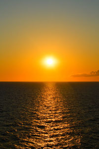 Scenic view of sea against clear sky during sunset