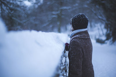 Woman standing on field during winter