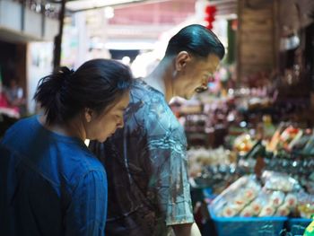 Friends looking at market