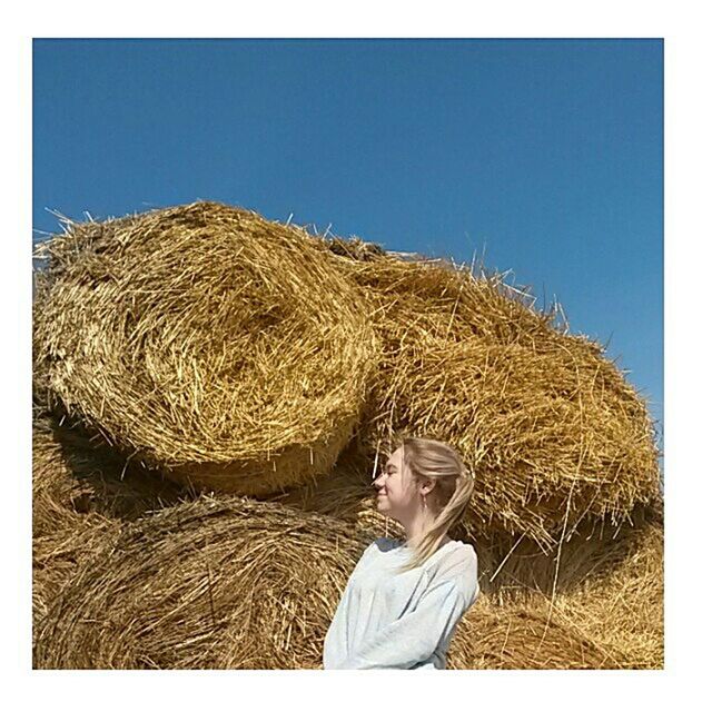 one person, adults only, only women, adult, agriculture, human body part, hay, outdoors, one woman only, people, day, nature, bale