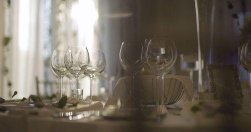 Close-up of wineglasses on table