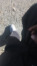 Low section of people standing on sand