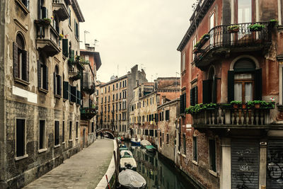 Street amidst buildings in city against sky