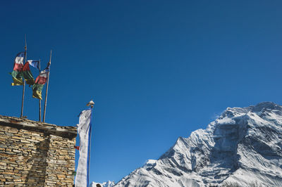 Low angle view of building against blue sky