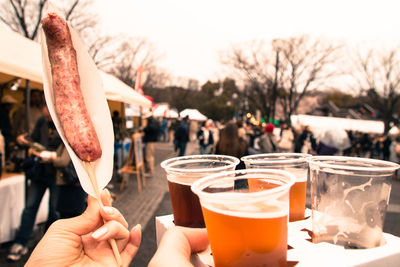 Close-up of hand holding drink