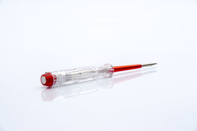 Close-up of screwdriver over white background