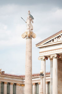 Low angle view of statue against cloudy sky
