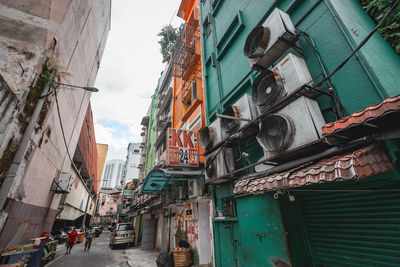 Low angle view of buildings in city against sky