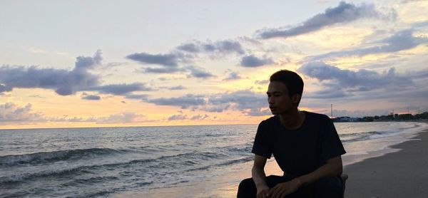 On a beautiful beach accompanied by orange sunset