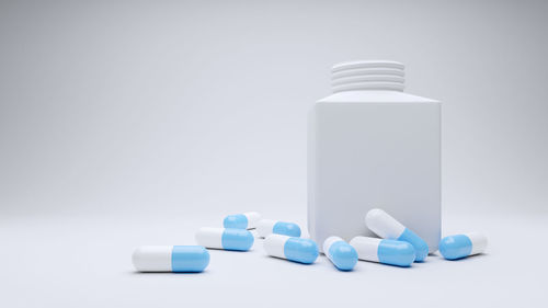 Close-up of bottles against white background