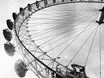 Low angle view of ferris wheel against sky