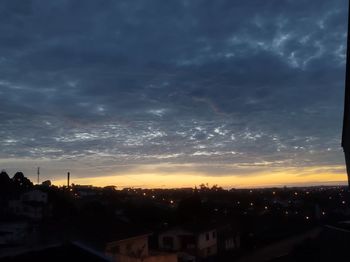 Silhouette buildings against sky during sunset