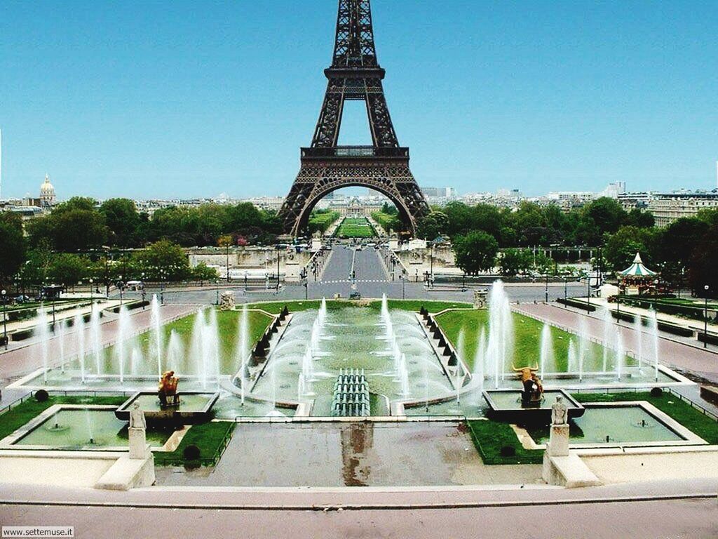 architecture, built structure, clear sky, building exterior, tree, famous place, travel destinations, city, fountain, capital cities, tourism, international landmark, travel, eiffel tower, incidental people, tower, water, park - man made space, day, outdoors