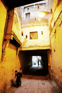 Man in corridor of building