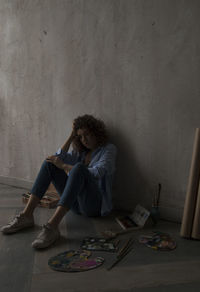 Woman sitting on table at home