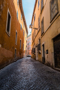 Alley amidst buildings in city