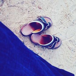 High angle view of shoes on sand