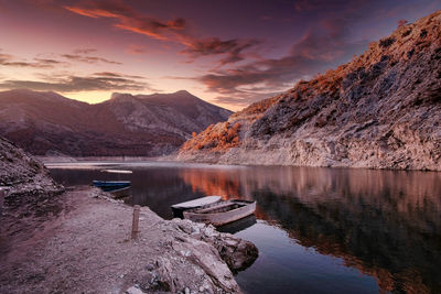 Scenic view of lake against sky during sunset