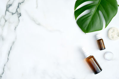 High angle view of bottle on white table