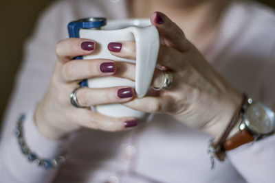 Close-up of hands holding cup