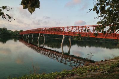 Bridge over river against sky