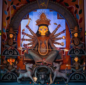 Buddha statue in temple outside building