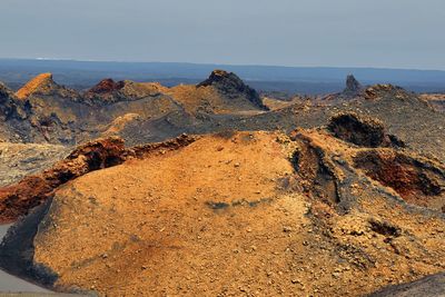 Scenic view of rock formations against sky