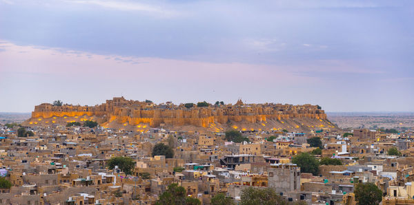 Aerial view of cityscape against sky