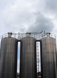 Low angle view of factory against sky