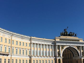 Low angle view of historical building against blue sky