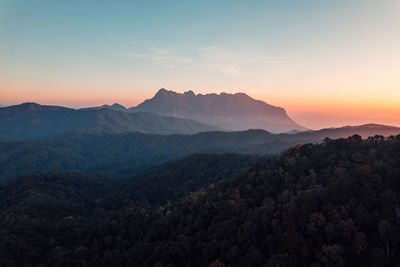 Idyllic view of mountains against sky during sunset