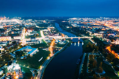 High angle view of illuminated buildings in city at night