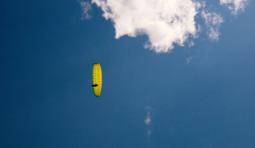 Low angle view of paraglide against sky